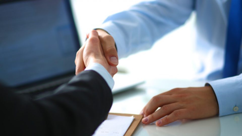 Business people shaking hands, finishing up a meeting