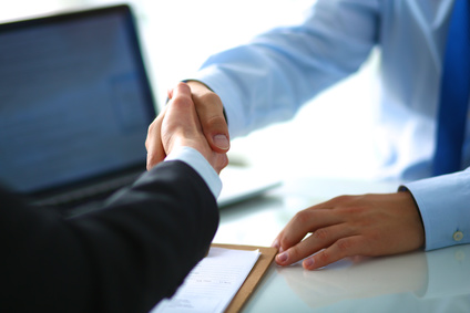 Business people shaking hands, finishing up a meeting